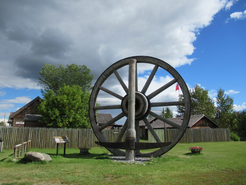 Large replica wagon wheel and pick outs walled fort.