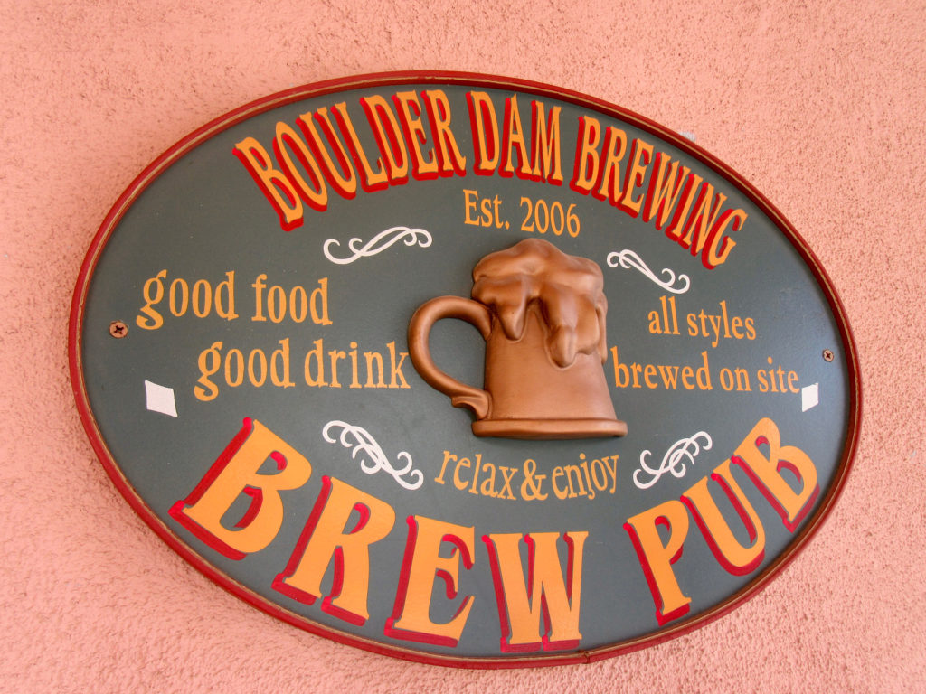 Sign for Boulder Dam Brewing Brewpub, established 2006. "Good food, good drink, all styles brewed on site."