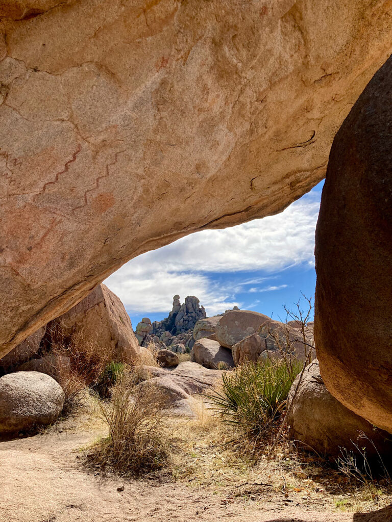 Rock art on large overhanging sandstone boulder.
