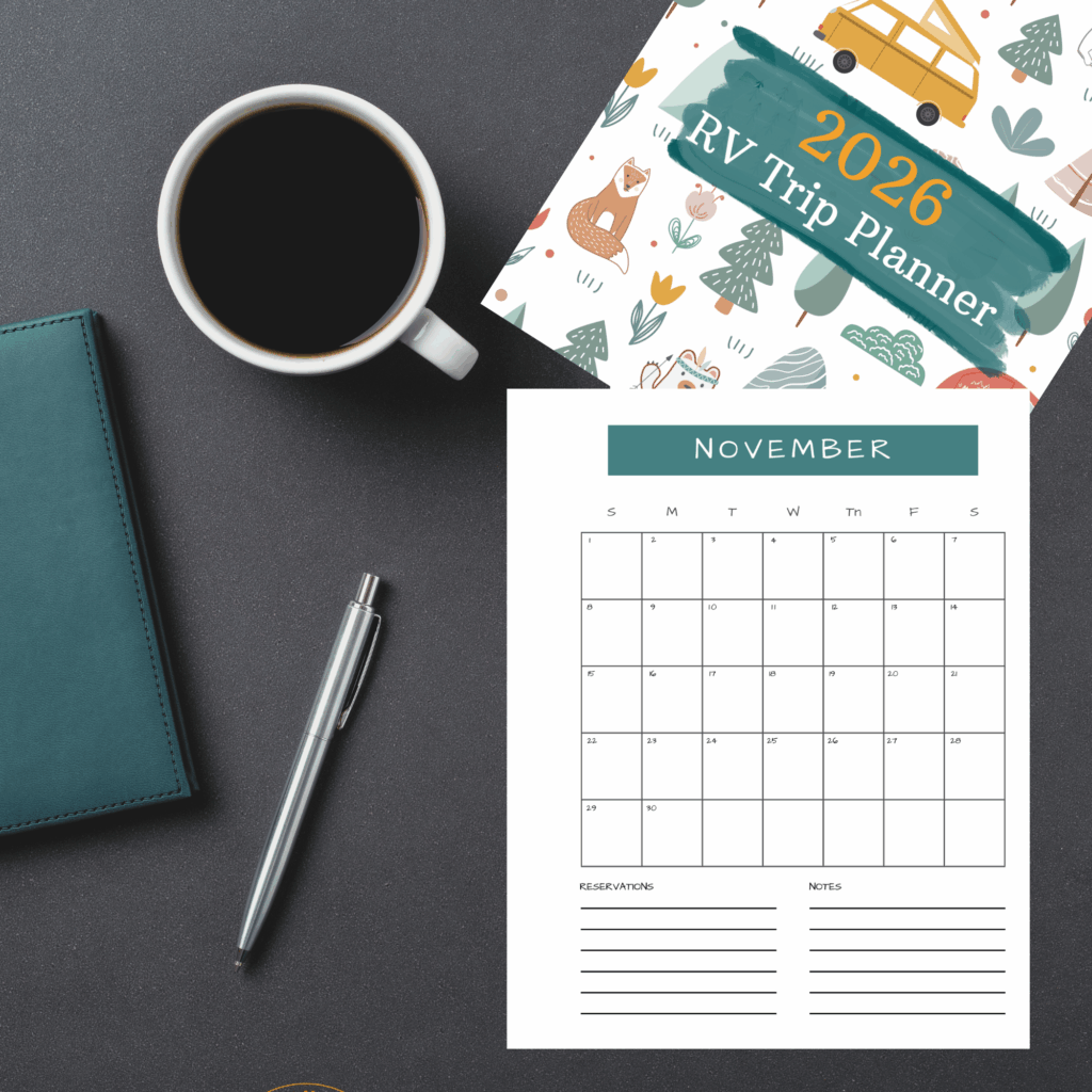 Coffe cup, pen, phone and papers on table.