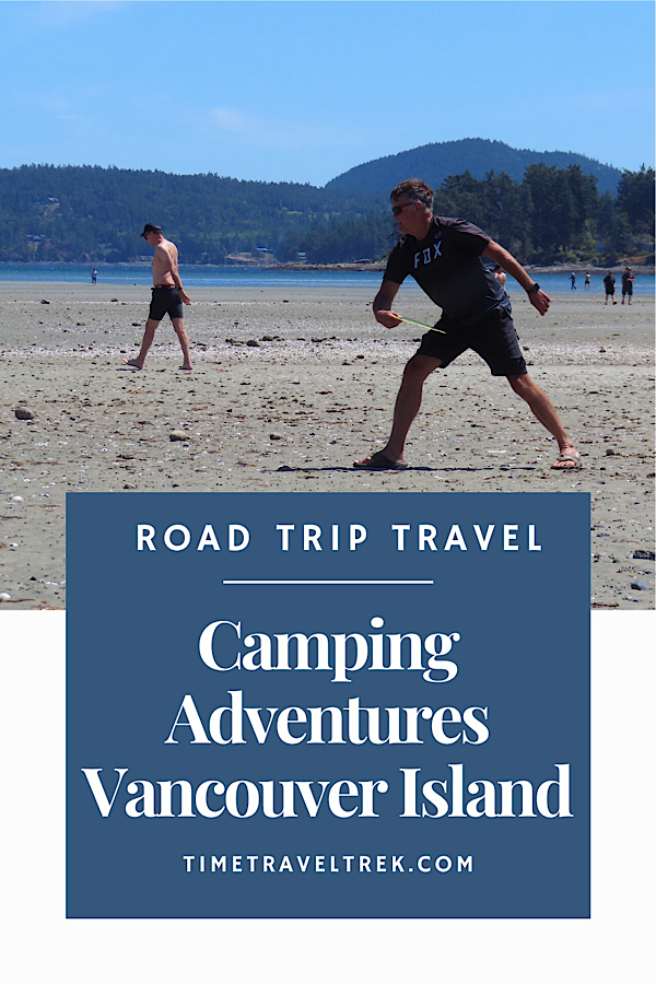 Man in shorts and shirt throwing frisbee on sandy beach
