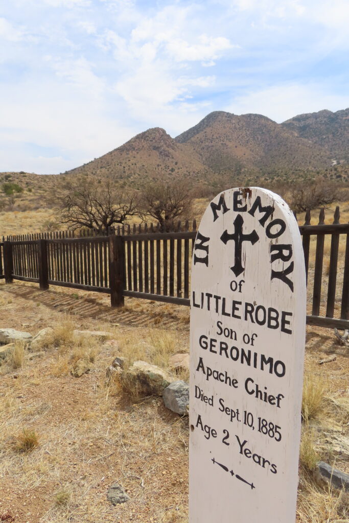 White grave marker reading: In Memory Little Robe, son of Geronimo Apache Chief. Died Sep 18, 1885. Age 2 years.