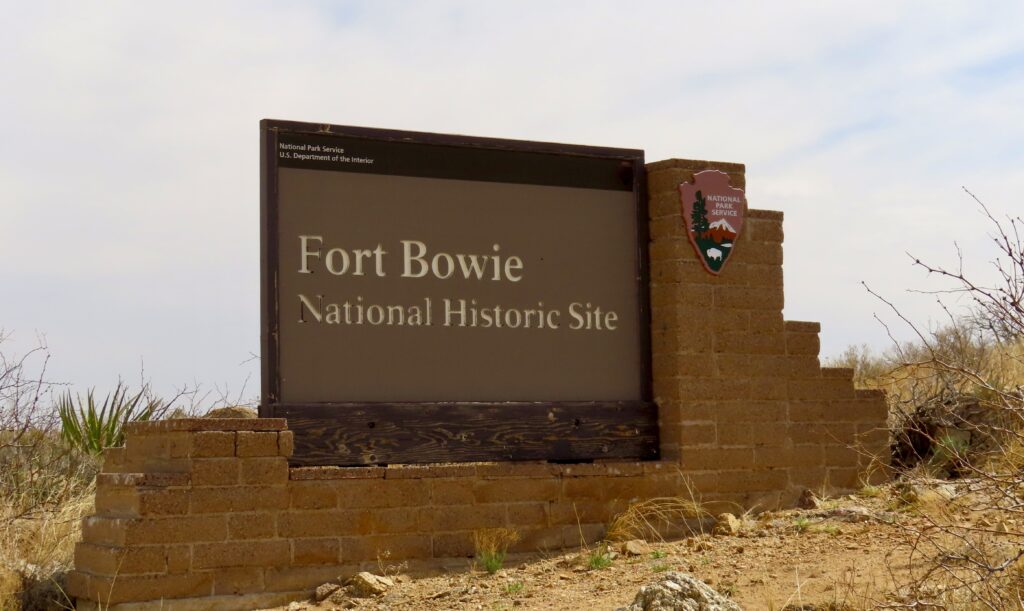 Brick and plaster entrance sign reading Fort Bowie National Historic Site.