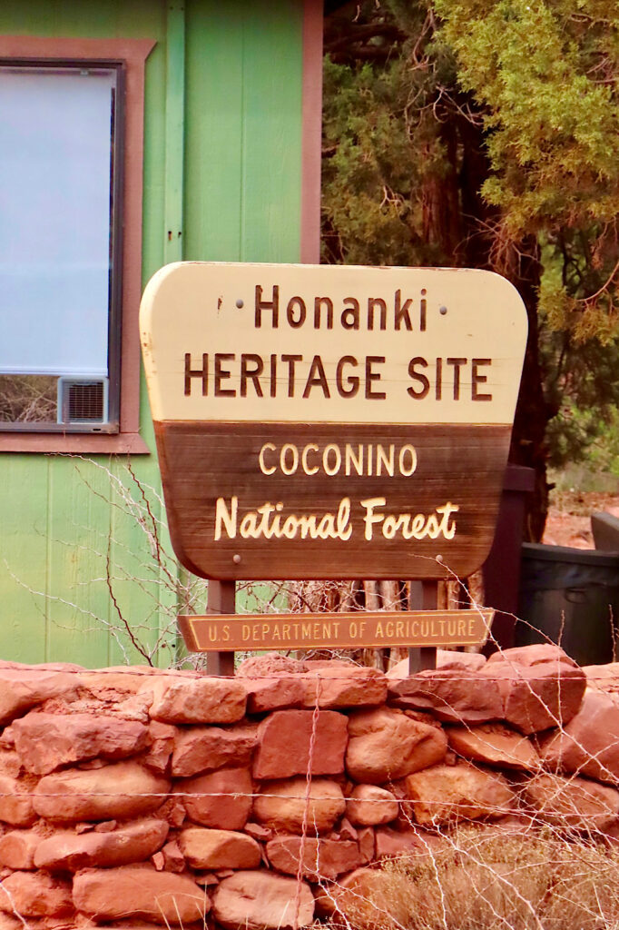 Entrance sign reading: Honanki Heritage Site. Coconino National Forest.
