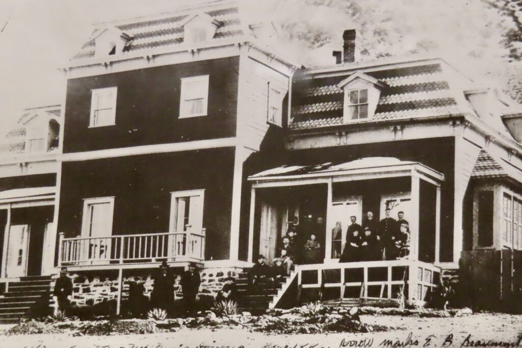 Black and white historic photo of old house.