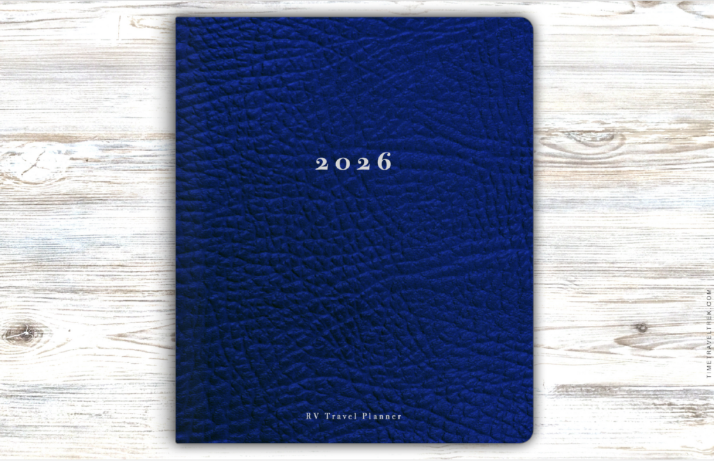 Blue journal with "2026" and "RV Travel Planner" written in silver on the front.