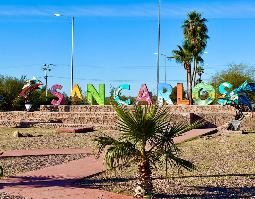 Brightly coloured entrance sign with letters spelling S-A-N-C-A-R-L-O-S