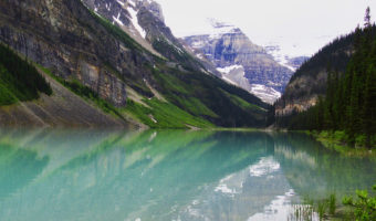 Turquoise lake with mountains in background