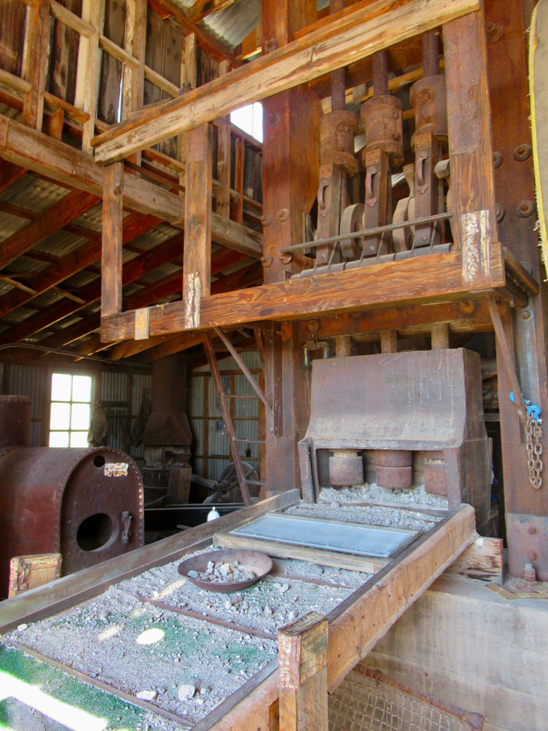 A wooden structure with crushed rock on tray running out front of the vertical structure.