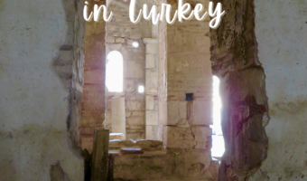 Pin image for TimeTravelTrek..com post reading: Travel Adventures Finding Christmas in Turkey. Text above image of old church interior.