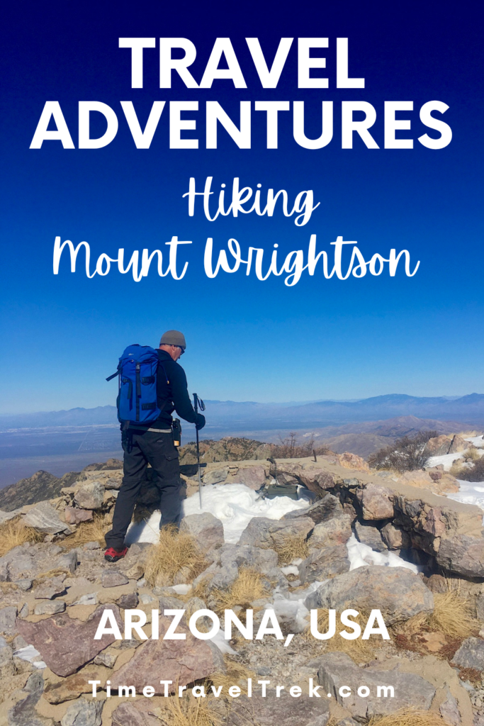 Pin image for TimeTravelTrek post reading: Travel Adventures Hiking Mount Wrightson Arizona USA TimeTravelTrek.com. White text over image of man with blue backpack hiking across a rocky and snowy peak under blue sky.