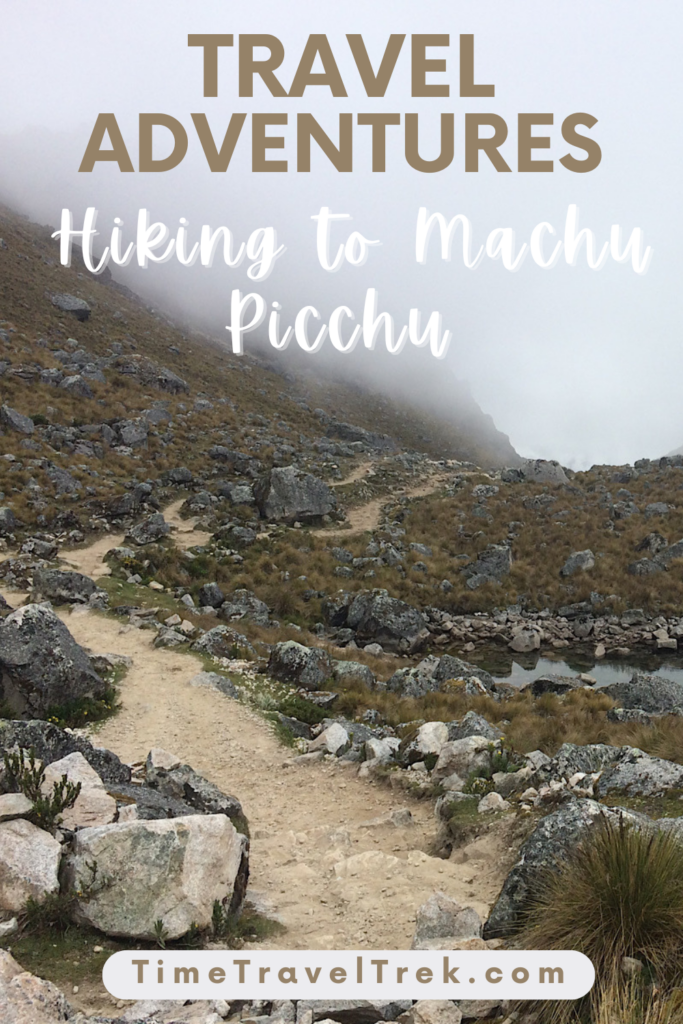 Pin image for TimeTravelTrek post with text reading: "Travel Adventures Hiking to Machu Picchu TimeTravelTrek.com" above photo of hiking path in rocky alpine area with high fog.