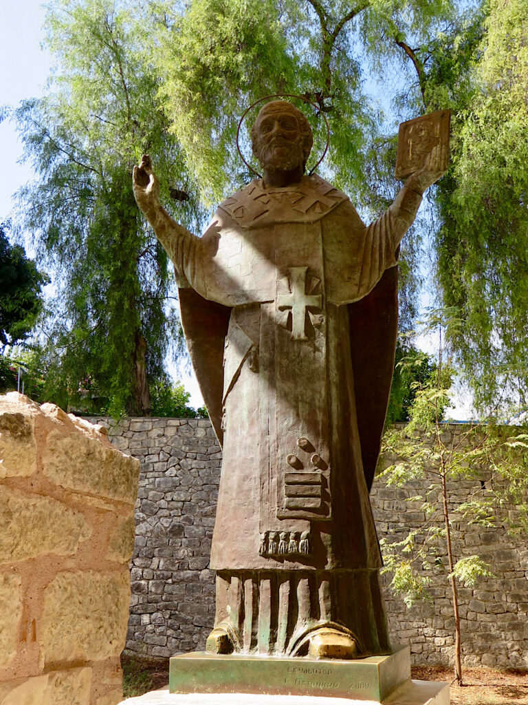 Bronze statue of man in robes.