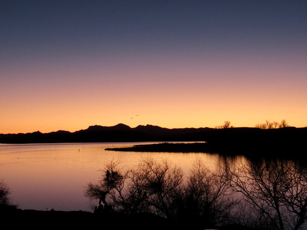 Sunset colours over a lake - one of the best places to paddle in Arizona.