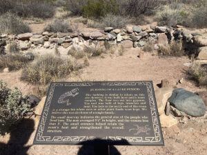 Rock ruins and interpretive sign.