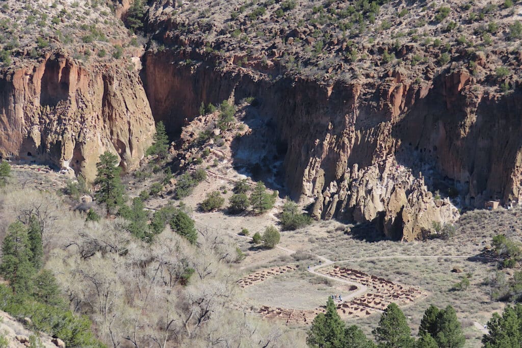 Aerial view of narrow canyon with ruins.