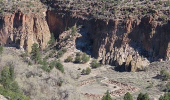 Aerial view of narrow canyon with ruins.