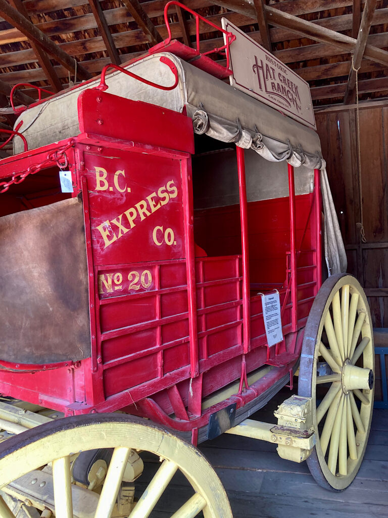 Large red stagecoach with yellow wheels. Lettering on side reads: BC Express Co. No.20