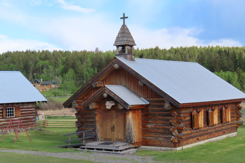 Wooden church with metal roof.
