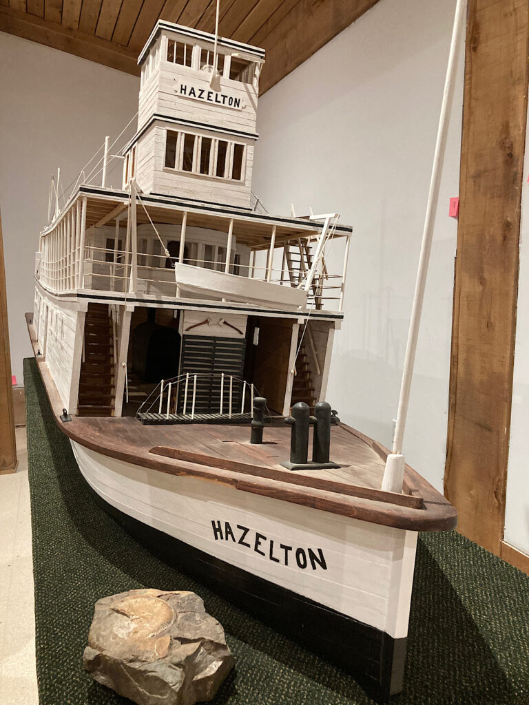 Replica white-painted three-storey boat named Hazelton.