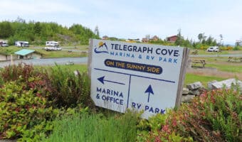 Sign for Telegraph Cove Marina and RV Park with arrows pointing to RV Park and Marina.