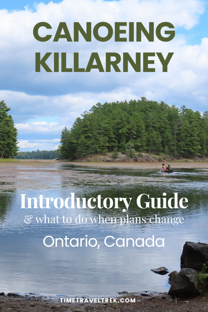 Pin image for TimeTravelTrek.com with photo of a canoe on a weed-choked lake. Text reads: Canoeing Killarney, Introductory Guide (and what to do when plans change). Ontario, Canada.