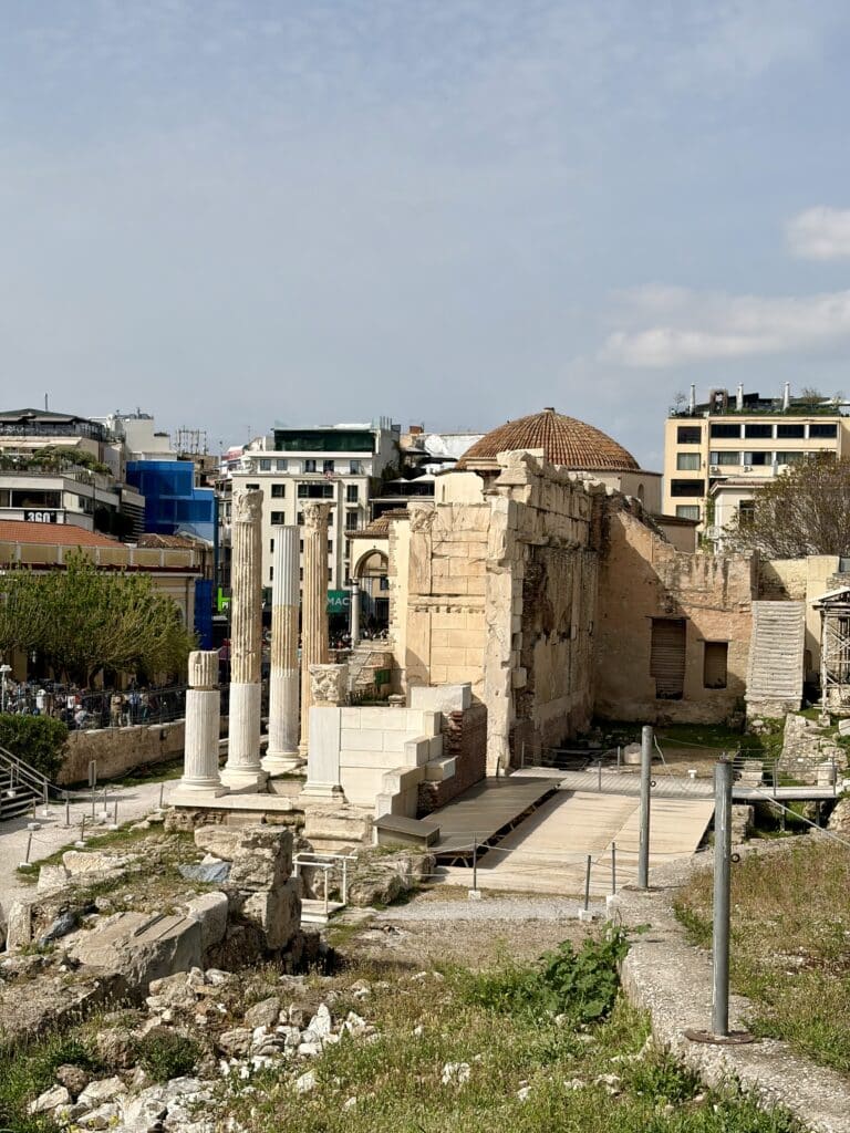 Ruins and columns in a city.