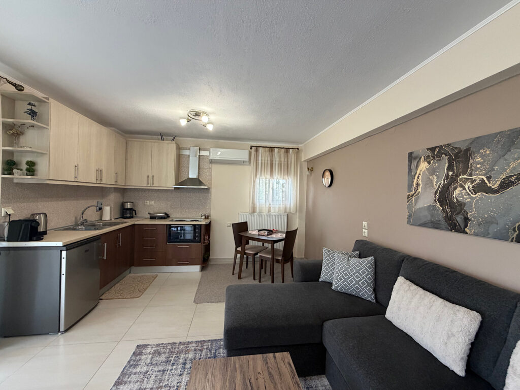 View of small kitchen and living room.